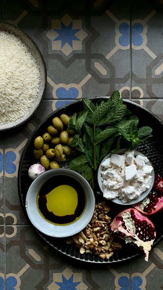 mediterranean diet ingredients including olive oil, vegetables, and herbs