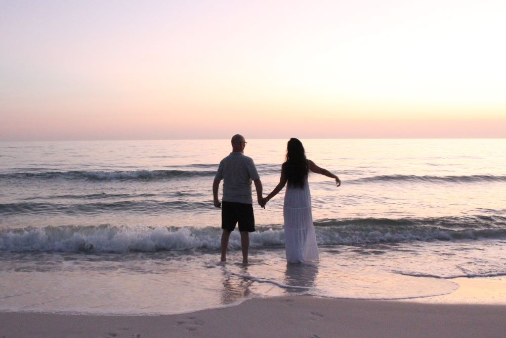 couple walking by the beach